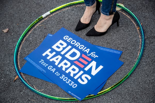 10/12/2020 - Decatur, Georgia - A Joe Biden supporter stands in a hula-hoop to ensure a social distance from other members of the audience during a rally for Presidential Democratic nominee Joe Biden and Vice President nominee Kamala Harris in downtown Decatur, Monday, October 12, 2020. The rally was hosted by Dr. Jill Biden and former Georgia gubernatorial candidate Stacey Abrams.  (Alyssa Pointer / Alyssa.Pointer@ajc.com)