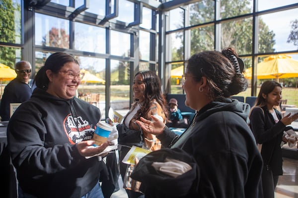 Arlene Rosado (middle left), a sophomore at Oglethorpe University, talks to another student during the First Generation Celebration at Oglethorpe University on Nov. 9, 2022. Oglethorpe celebrated students who were the first in their families to attend college. (Christina Matacotta for The Atlanta Journal-Constitution)