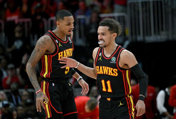 Atlanta Hawks' guard Dejounte Murray (5) and guard Trae Young (11) celebrate after scoring during the second half in Game 3. (Hyosub Shin / Hyosub.Shin@ajc.com)