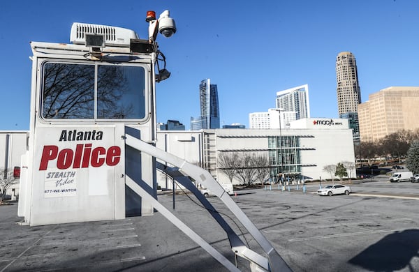 February 10, 2022 Atlanta: A police surveillance tower overlooks Lenox Square on Thursday, Feb. 10,2022. Continuing a string of violent incidents at Lenox Square, a man who had just bought a new pair of pricey Nike Air Jordan 1 sneakers recently became the latest victim of violent crime on the luxury mall’s property.  (John Spink / John.Spink@ajc.com)


