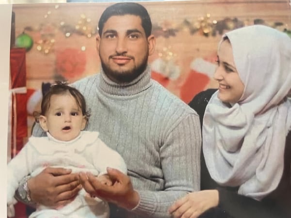 Shukri and Sabreen Sakani with their daughter, Malak, in Gaza.  The family was killed in an airstrike on their home in Rafah in April 2023. Sabreen Sakani was seven months pregnant at the time. Her baby was delivered but died five days later. (Family photo)