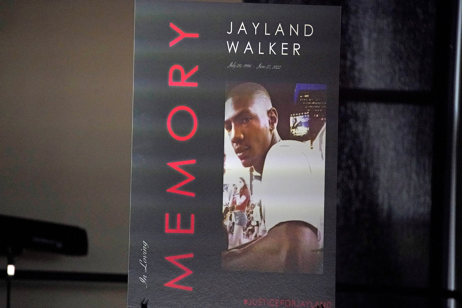 FILE - This is a poster on the stage during a news conference following the funeral service for Jayland Walker at the Akron Civic Center in Akron, Ohio, July 13, 2022. (AP Photo/Gene J. Puskar, file)