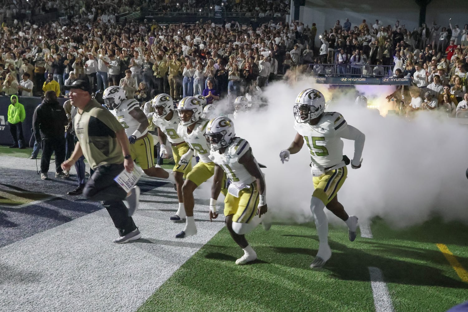 Georgia Tech Yellow Jackets head coach Brent Key leads the team onto the field before an NCAA college football game between Georgia Tech and Syracuse in Atlanta on Saturday, Nov. 18, 2023.  Georgia Tech won, 31 - 22. (Bob Andres for the Atlanta Journal Constitution)