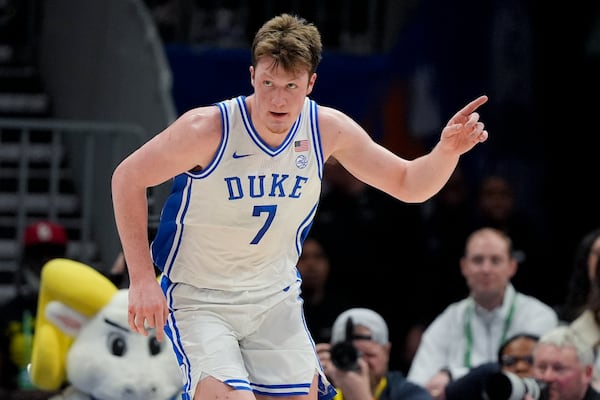 Duke guard Kon Knueppel celebrates after scoring against North Carolina during the first half of an NCAA college basketball game in the semifinals of the Atlantic Coast Conference tournament, Friday, March 14, 2025, in Charlotte, N.C. (AP Photo/Chris Carlson)