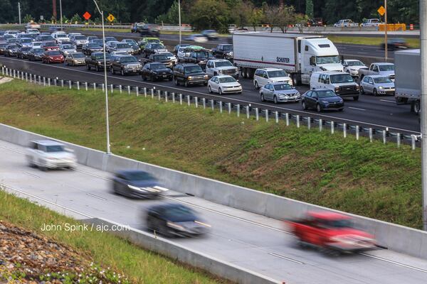 The Northwest Corridor Express Lanes got their first stress test Monday morning. JOHN SPINK / JSPINK@AJC.COM