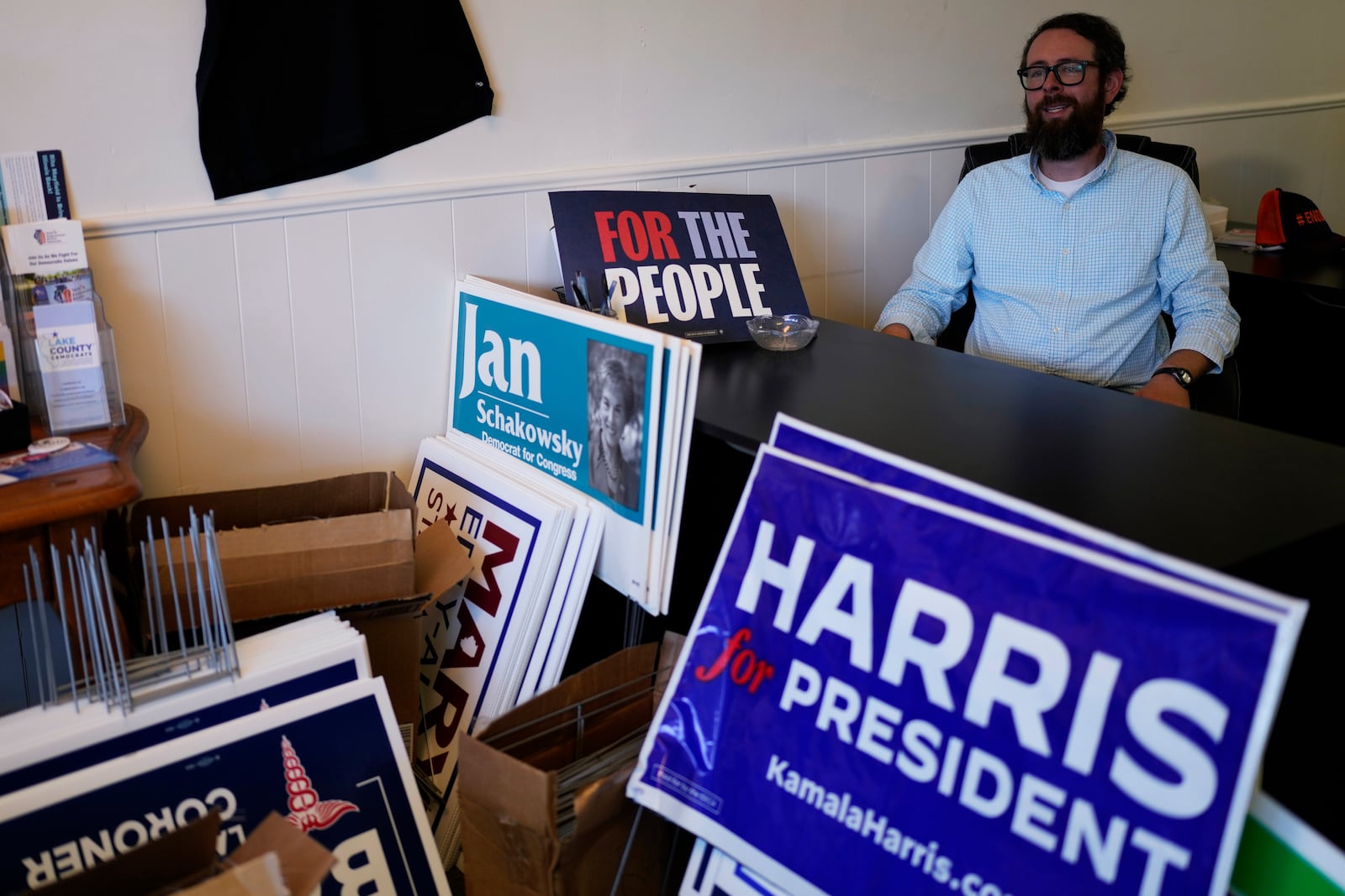 Matt Muchowkshi, chair of the Waukegan Township Democrats, looks outside from the Waukegan Township Democrats office in Waukegan, Ill., Monday, Sept. 16, 2024. (AP Photo/Nam Y. Huh)