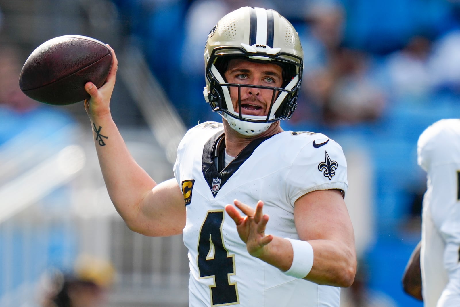 New Orleans Saints quarterback Derek Carr passes against the Carolina Panthers during the first half of an NFL football game Sunday, Nov. 3, 2024, in Charlotte, N.C. (AP Photo/Rusty Jones)