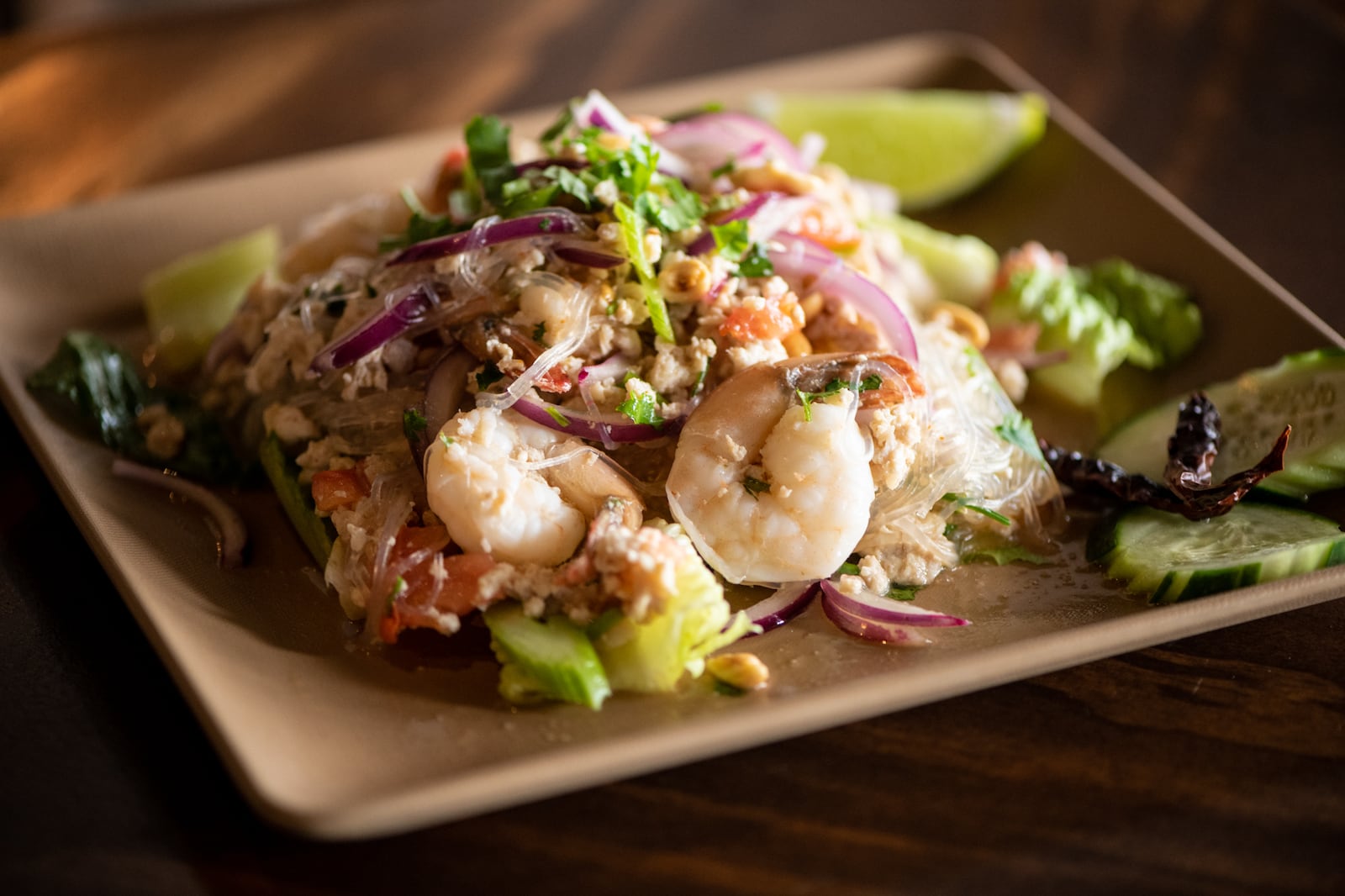 Rickshaw Thai Street Food Yum Woon Sen, clear noodle mixed with ground chicken and shrimp in red onions, scallions, tomatoes, celery, peanuts and chile lime dressing. (Mia Yakel for The Atlanta Journal-Constitution)