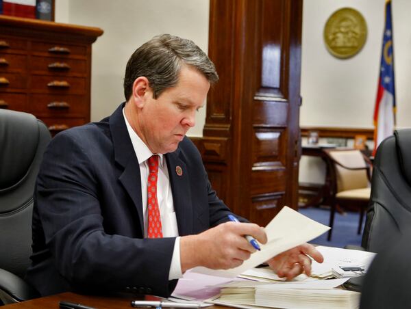 January 27, 2015 - Atlanta - Brian Kemp in a staff meeting at his office in the Capitol. The office of Georgia Secretary of State Brian Kemp is in line for an almost 10 percent budget increase next year, a financial pat on the back from Gov. Nathan Deal. BOB ANDRES / BANDRES@AJC.COM