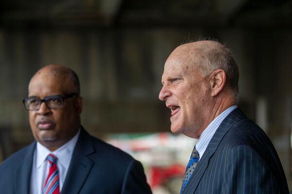 Attorneys Bill Thomas, left, and Randy Chartash speak about their client, former Georgia insurance commissioner Jim Beck, outside the Russell Federal Courthouse in downtown Atlanta on Tuesday, October 12, 2021. Beck was sentenced to seven years in prison. (Alyssa Pointer/ Alyssa.Pointer@ajc.com)