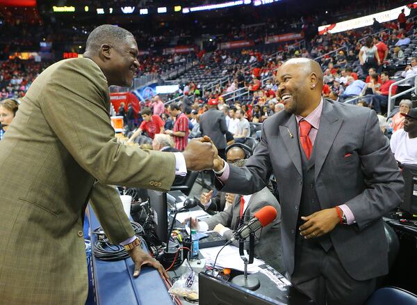 041915 ATLANTA: Hawks public announcer Ryan Cameron greets Dominique Wilkins before tip off in the first round home playoff game against the Nets on Sunday, April 19, 2015, in Atlanta. Curtis Compton / ccompton@ajc.com 041915 ATLANTA: Hawks public announcer Ryan Cameron greets Dominique Wilkins before tip off in the first round home playoff game against the Nets on Sunday, April 19, 2015, in Atlanta. Curtis Compton / ccompton@ajc.com