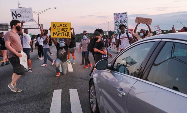 Demonstrators get on to I-75 and shut down the interstate on Saturday night.       Ben Gray for the Atlanta Journal Constitution