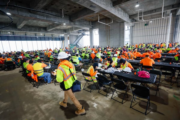 Construction workers celebrated with lunch on Wednesday to mark a milestone in the construction of the Phoenix Hotel, which has now reached its highest point. The boutique hotel is one of six buildings under construction at Centennial Yards in Downtown Atlanta. Miguel Martinez/AJC