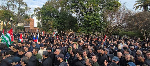 In this photo taken from video released by AIASHARA Independent Agency, Protesters gather outside the parliament building of the Georgian separatist region of Abkhazia as tensions flared over a proposed pact that would allow Russians to buy apartments in the region, Georgia, on Friday, Nov. 15, 2024. (AIASHARA Independent Agency via AP)