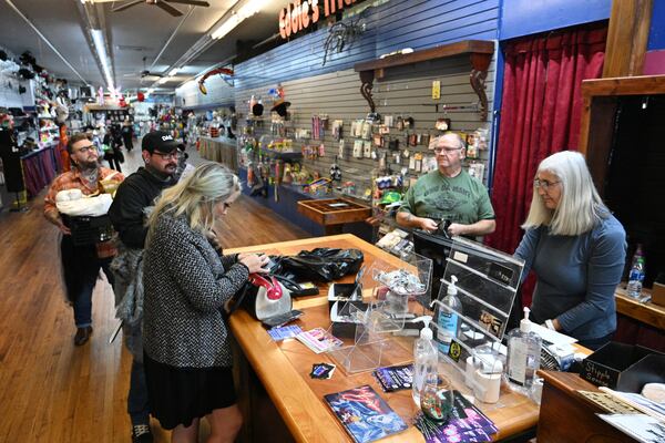 Customers shop during store closing sale at Eddie's Trick Shop in Marietta Square, Tuesday, February 6, 2024, in Marietta. Eddie’s Trick Shop, which sells and rents costumes and accessories and magic tricks, has been a Marietta staple since the mid-1970s. They announced on Feb. 2 they are closing down later this month. Currently, they are selling everything 60% off and a good portion of the store has already bene emptied. (Hyosub Shin / Hyosub.Shin@ajc.com)