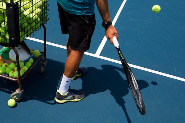 Raian Luchici, 35, Director of Tennis at Bitsy Grant Tennis Center, gives lessons to a young tennis player at the center in Atlanta, Ga., on Friday, June 28, 2019. (Casey Sykes for The Atlanta Journal-Constitution)