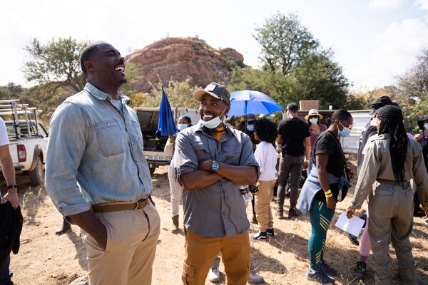 Idris Elba and producer Will Packer on the set of "Beast." UNIVERSAL