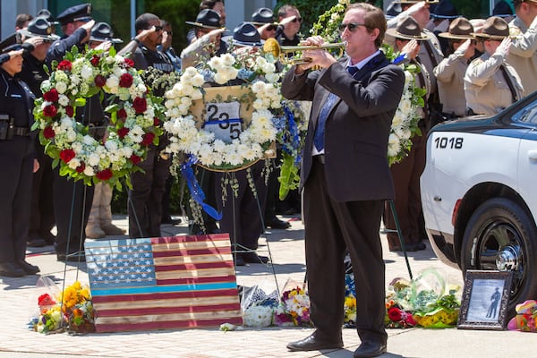 John-Thomas Burson plays Taps after the funeral of Holly Springs Police Officer Joe Burson at First Baptist Church of Woodstock on June 21, 2021.  STEVE SCHAEFER FOR THE ATLANTA JOURNAL-CONSTITUTION