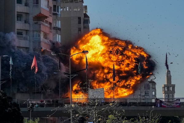 Thick smoke and flames erupt from an Israeli airstrike on Tayouneh, Beirut, Lebanon, Friday, Nov. 15, 2024. (AP Photo/Hassan Ammar)