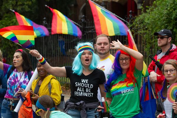 Amie Meditz (L) and Helen Ward cheer on the parade during the 49th annual Pride Festival and Parade in Atlanta on Sunday, Oct 13, 2019.  STEVE SCHAEFER / SPECIAL TO THE AJC