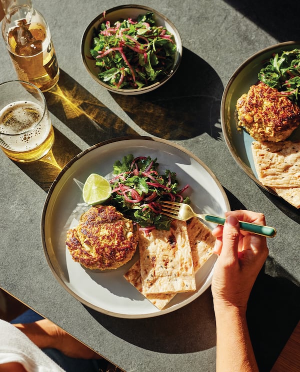 Smashed Turkey Burgers with Sumac Onions and Parsley from Yasmin Fahr’s “Cook Simply, Live Fully” draws inspiration from the Middle East to take inexpensive kitchen staples to new heights. (Photography by Matt Russell)