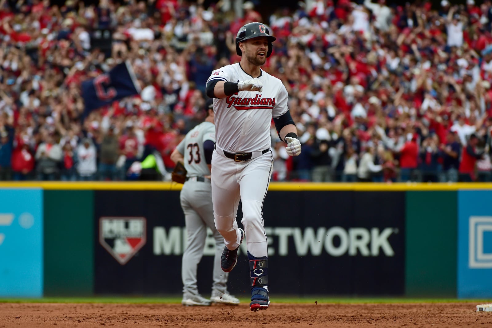 Cleveland Guardians' Lane Thomas celebrates as he runs the bases after hitting grand slam in the fifth inning during Game 5 of baseball's American League Division Series against the Detroit Tigers, Saturday, Oct. 12, 2024, in Cleveland. (AP Photo/Phil Long)