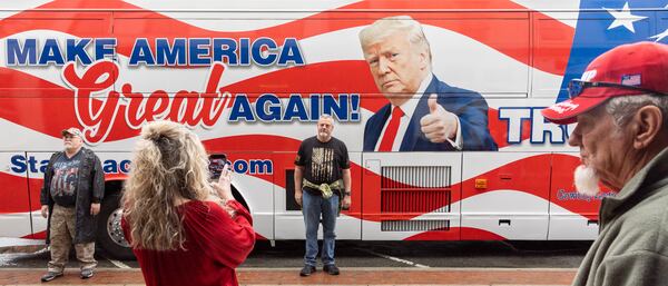 Supporters take photos outside a rally for Republican presidential candidate and former president Donald Trump at Forum River Center in Rome on Saturday, March 9, 2024. (Arvin Temkar / arvin.temkar@ajc.com)