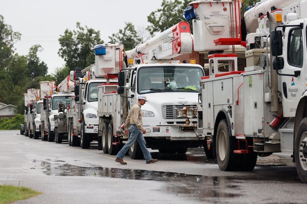 Mississippi Power trucks are seen parked outside an abandoned school, ready to be deployed to help restore power in the Lakeland area of south Georgia in the aftermath of Hurricane Debby on Tuesday, August 6, 2024.
(Miguel Martinez / AJC)