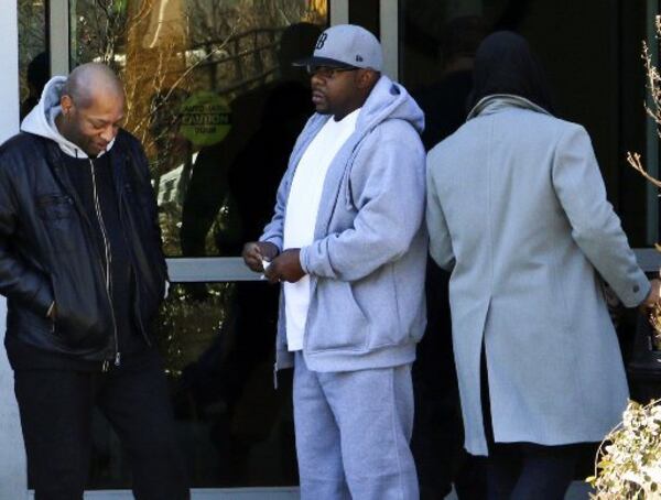 Entertainer Bobby Brown, center, at Emory Hospital in Atlanta when Bobbi Kristina Brown was there. She's since been moved to a long-term care facility. Photo: AP/Ron Harris