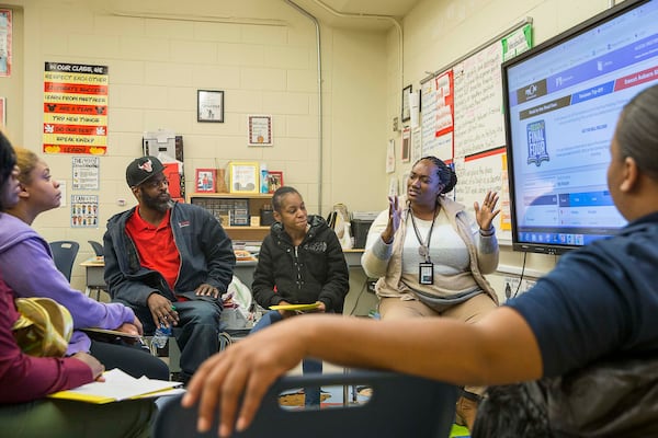 Harper-Archer Elementary fifth grade teacher Alecia Westbrooks (right) speaks with some of her student's parents during a parent engagement meeting at the school, Tuesday, November 19, 2019. Westbrooks, a former teacher at Fain Elementary school, says she is focused on praising her students for their efforts instead of focusing on solely academics for their growth. (ALYSSA POINTER/ALYSSA.POINTER@AJC.COM)