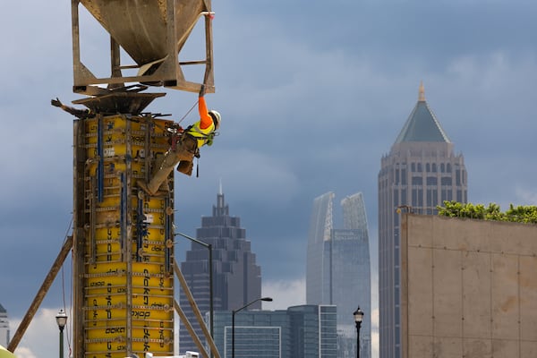 Workers prepare forms near 17th Street in West Midtown Atlanta on Wednesday, May 15, 2024 where Southeastern Development Brokerage Consulting is developing a mixed-use project called UrbA ATL which will have 321 luxury apartments and about 27,000 square feet of retail and restaurants. Atlanta is surpassing other cities in population growth. (John Spink/AJC)