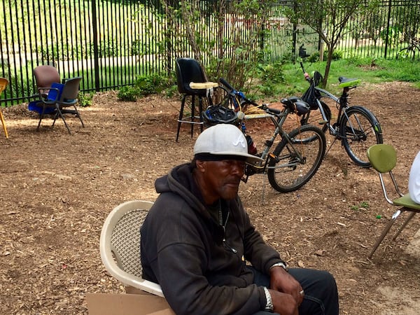 William Harden, his bicycle parked behind him, appreciates the safety brought by bike lanes on Westview Drive in Atlanta. (Photo by Bill Torpy)