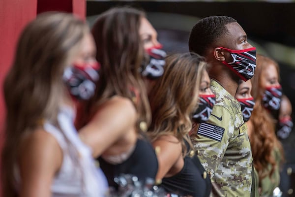 Atlanta Falcons cheerleaders perform in U.S. uniformed service like-outfits during the game at Mercedes-Benz Stadium in Atlanta, Sunday, November 8, 2020. (Alyssa Pointer/Atlanta Journal-Constitution/TNS)