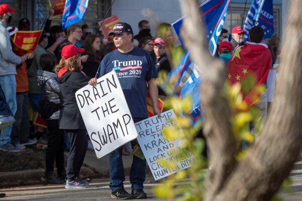 Supporters of President Donald Trump hold a counter-rally outside of a “Get Ready to Vote” rally for Georgia Democrat U.S. Senator candidates the Rev. Raphael Warnock and Jon Ossoff at Pratt-Pullman Yard in Atlanta’s Kirkwood neighborhood, Tuesday, Dec. 15, 2020.  (Alyssa Pointer / Alyssa.Pointer@ajc.com)