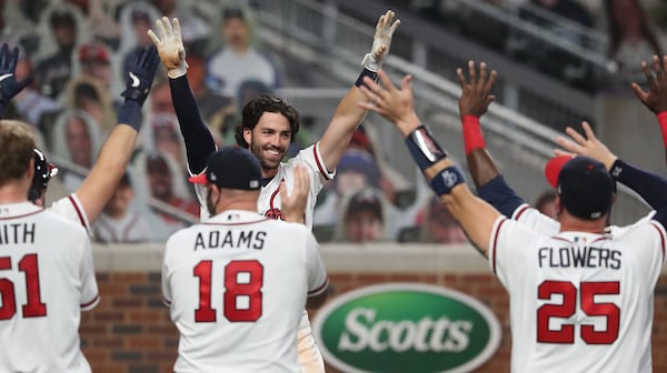 Braves shortstop Dansby Swanson celebrates hitting a two-RBI walk off home run to beat the Nationals 7-6 with Monday, Aug. 17, 2020 in Atlanta. The team is 18-12 after 30 games.