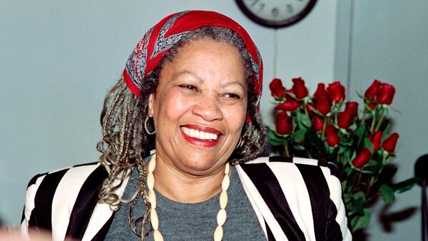 Toni Morrison smiles in her office at Princeton University while being interviewed by reporters after hearing that she had won the Nobel Prize for Literature.