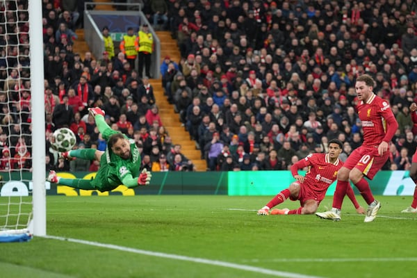 PSG's goalkeeper Gianluigi Donnarumma watches the ball hit the post during the Champions League round of 16 second leg soccer match between Liverpool and Paris Saint-Germain at Anfield in Liverpool, England, Tuesday, March 11, 2025. (AP Photo/Jon Super)