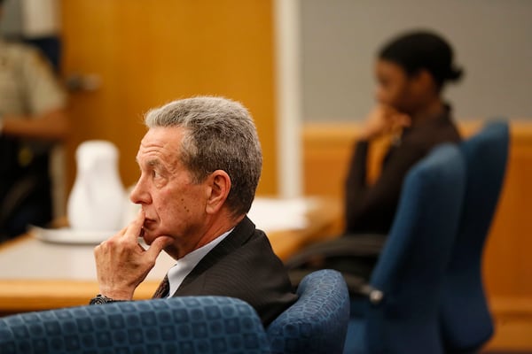 District attorney Danny Porter listens as assistant district attorney Lisa Jones makes final arguments during the Tiffany Moss murder trial on April 29, 2019.