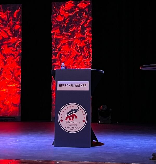 An image of Herschel Walker’s empty podium at the 9th District GOP debate in Gainesville. 