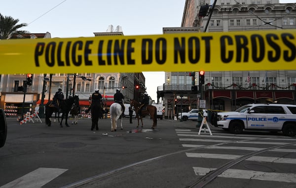 Several law enforcement agencies are seen around Bourbon Street, where a vehicle drove into a crowd and killed at least 14 people on Wednesday, Jan. 1, 2025, in the French Quarter of New Orleans. (Hyosub Shin/AJC)