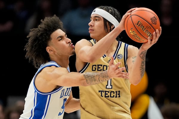 Duke guard Tyrese Proctor guards Georgia Tech guard Naithan George during the second half of an NCAA college basketball game in the quarterfinals of the Atlantic Coast Conference tournament, Thursday, March 13, 2025, in Charlotte, N.C. (AP Photo/Chris Carlson)