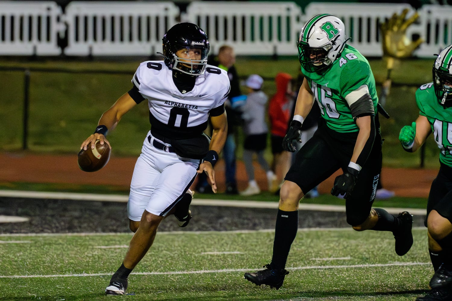 Alpharetta's quarterback, Dj Bordeaux, looks to make the pass during the Alpharetta at Roswell football game, November 3, 2023. (Jamie Spaar for the Atlanta Journal Constitution)