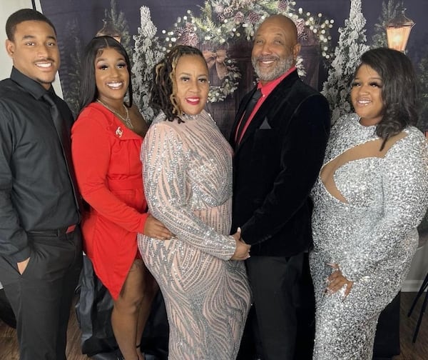 Artez Benton, left, was slain in a shooting in Buckhead late Sunday night. He stands with his 24-year-old sister Arteria, second from left, his mother Bridget, his father Artis and his oldest sister Bria, far right.