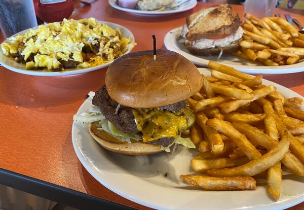 Among the recommended dishes available at Sunny Side Up in Brunswick are (from left) the Tex Mex bowl, cheeseburger with fries and tuna melt. (Ligaya Figueras/ligaya.figueras@ajc.com)