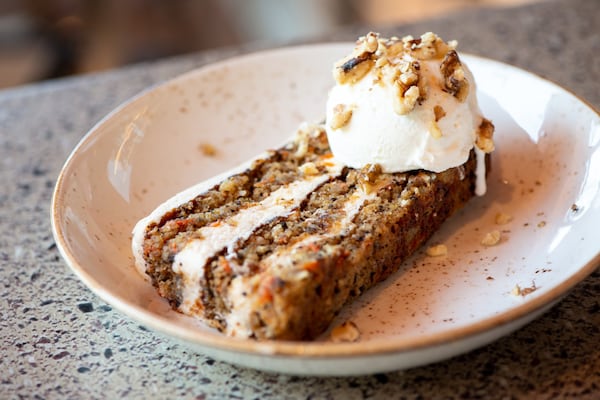 Carrot Cake, made in-house with almond flour, walnuts, golden raisins, shredded coconut, and  pineapple buttercream frosting. Photo credit- Mia Yakel.