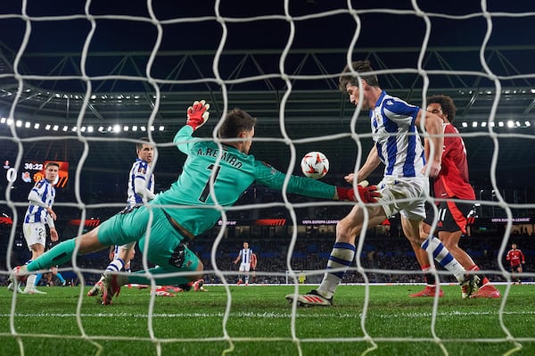 Real Sociedad's goalkeeper Alex Remiro makes a save during the Europa League round of 16 first leg soccer match between Real Sociedad and Manchester United at the Reale Arena in San Sebastian, Spain, Thursday, March 6, 2025. (AP Photo/Miguel Oses)