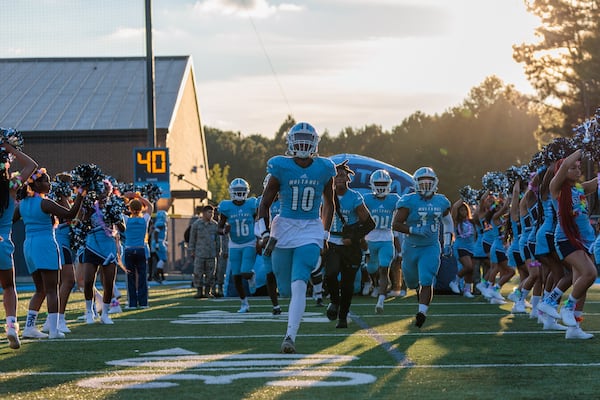 Meadowcreek enters the field in the first half at Meadowcreek High School in Norcross on Friday, Aug. 26, 2022. (Arvin Temkar / arvin.temkar@ajc.com)