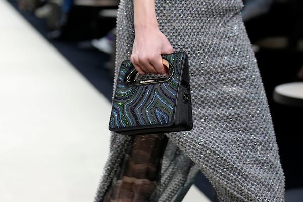 A model wears a creation as part of the Giorgio Armani Fall/Winter 2025-2026 Women's collection presented in Milan, Italy, Sunday, March 2, 2025. (AP Photo/Luca Bruno)