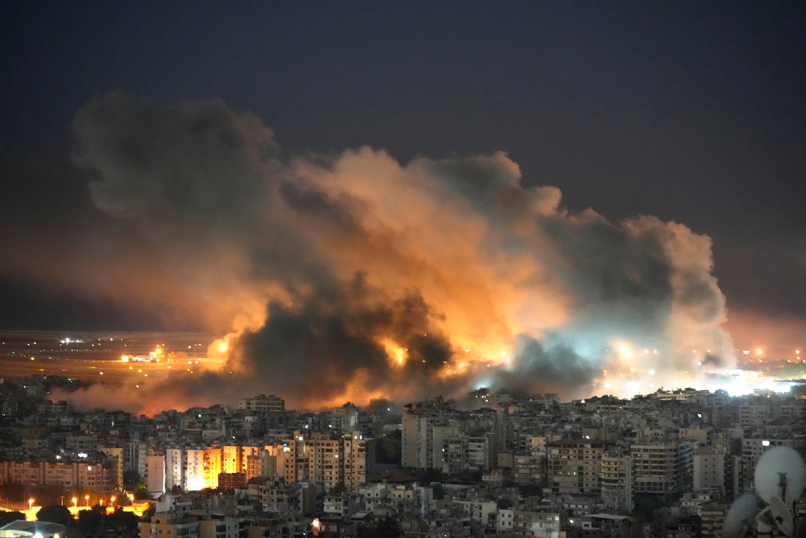 Flames and smoke rise form Israeli airstrikes on Dahiyeh, in the southern suburb of Beirut, Lebanon, Sunday, Oct. 20, 2024. (AP Photo/Hussein Malla)