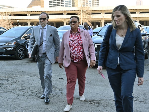 Mitzi Bickers, center, faces 12 counts related to an alleged conspiracy involving pay-to-play contracting. Her trial was originally scheduled for April 2020, but it was repeatedly delayed by the pandemic. (Hyosub Shin / Hyosub.Shin@ajc.com)